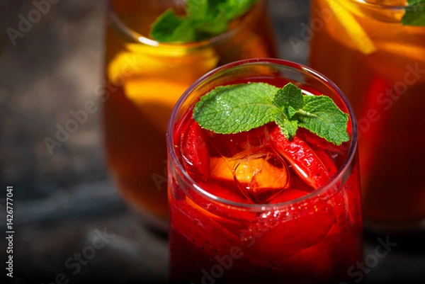 Obraz glasses of refreshing cold black and fruit tea, top view