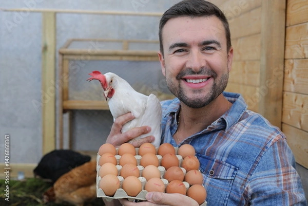 Fototapeta Man holding bio egss and a cute hen 