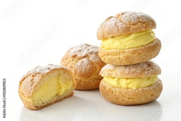 Fototapeta Decadent Cream Puffs: A Tempting Close-Up of Fluffy Pastry and Creamy Custard Filling, Perfectly Stacked Against a Pristine White Background, Ideal for Culinary Websites, Blogs, and Recipe Books,     