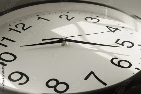 Fototapeta Clock With Second, Minute and Hour Hands With Sun Flare Reflection During the Day. Modern Wall Clock Show the Running Time