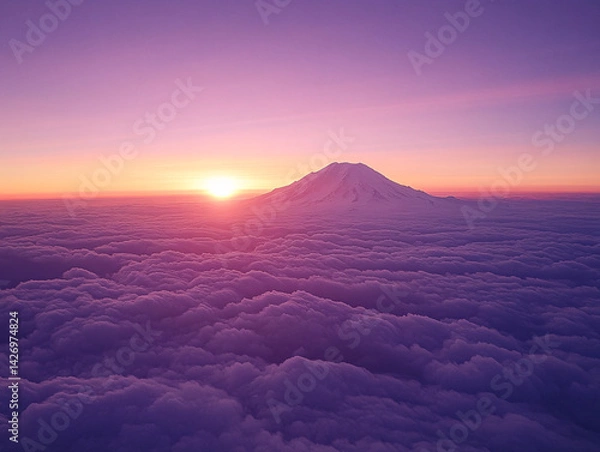Fototapeta breathtaking view of a snow-covered mountain at sunset, with the sky painted in hues of pink and purple. The mountain peak is illuminated by the soft light of the setting sun