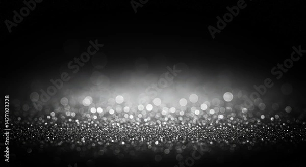 Fototapeta Elegant sparkling glitters on dark background creating festive ambiance, ideal backdrop for christmas celebration, new year greetings and luxury event invitations.