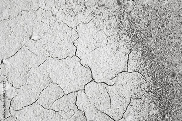 Fototapeta Top view of cracked and barren ground.