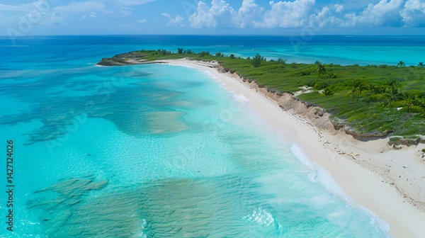 Fototapeta Aerial view of a tropical beach with turquoise water and white sand under a bright blue sky day .