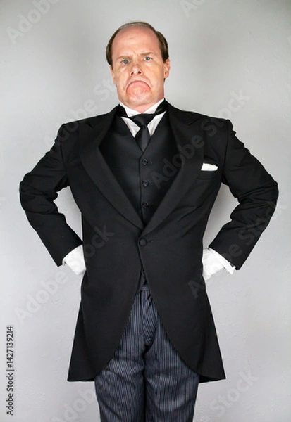 Fototapeta Stuffy Butler in Formal Suit and White Gloves With a Mean Expression. Stuck Up Upper Class Snob