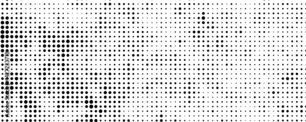 Fototapeta Halftone dotted abstract background. Grain gradient texture background with dots.