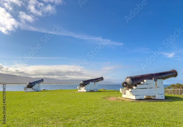 Fototapeta A view of the coastline near Wollongong with the cannons of Flagstaff Point Lighthouse in the foreground