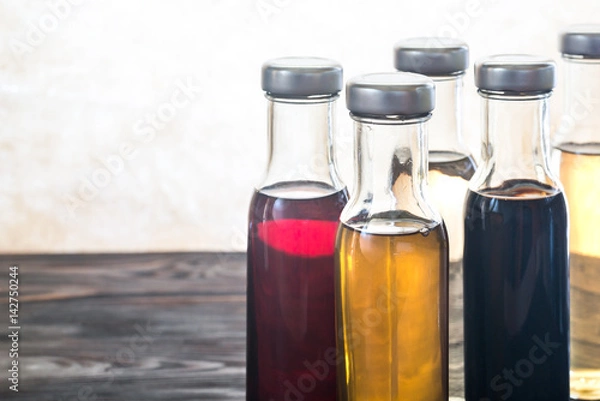 Fototapeta Bottles with different kinds of vinegar