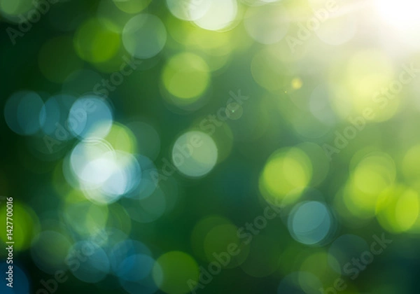 Obraz With soft green and blue circles illuminated by bright sunlight rays, a blurred abstract bokeh background presents a calm and ethereal natural light effect