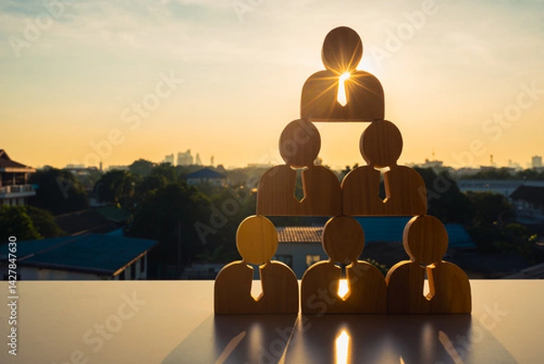 Fototapeta Person model standing on another man who was an employee The concept of Teamwork of bosses, empowerment and inspiration for crowd. Leader with influence, leadership.