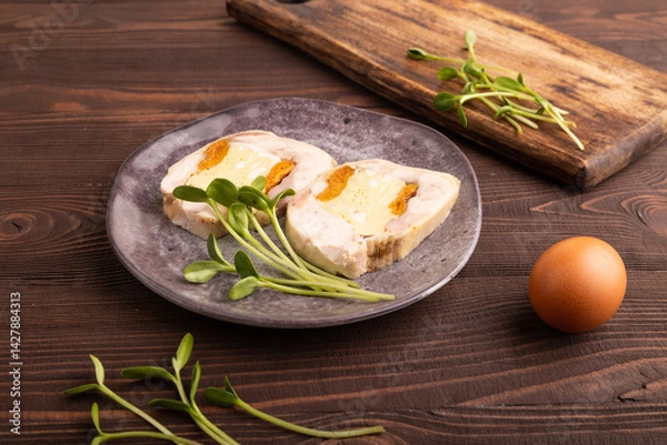 Obraz Chicken, egg and dried apricot meatloaf, microgreen on brown wooden. Diet, healthy eating. side view, close up