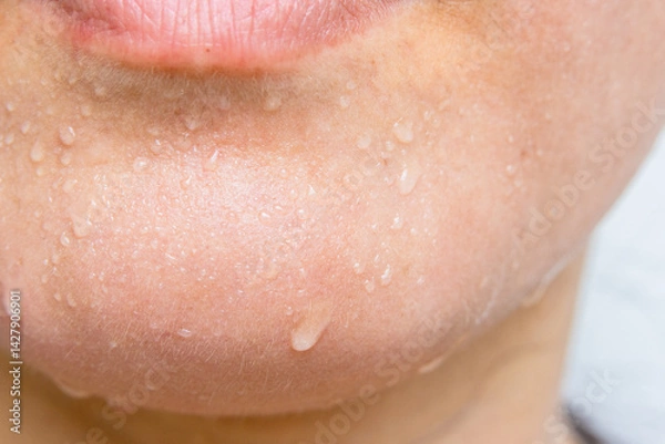 Obraz Close-up of a woman's face sweating in the hot summer