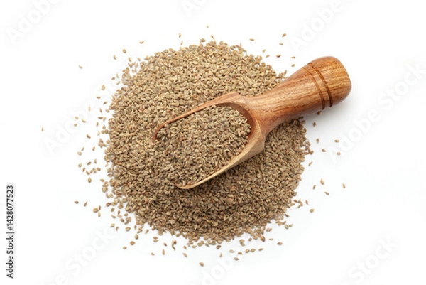 Obraz A wooden scoop filled with organic Carom seeds (Trachyspermum ammi) or Ajwain, placed on a heap of whole Carom Seeds, isolated on a white background.