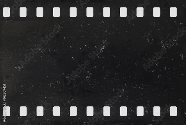 Fototapeta Pasek starego negatywnego filmu celuloidowego z pyłem i zarysowaniami