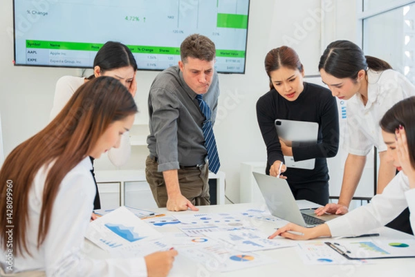 Fototapeta Group of business people are having a meeting and looking stressed about the work they are trying to solve.