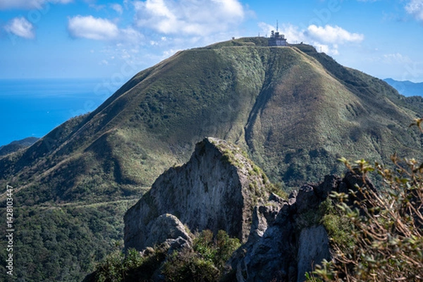 Obraz Cao Shan mountain in the cloudy day, sunlight shines between the cloud, in New Taipei City, Taiwan.