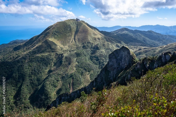 Obraz Cao Shan mountain in the cloudy day, sunlight shines between the cloud, in New Taipei City, Taiwan.