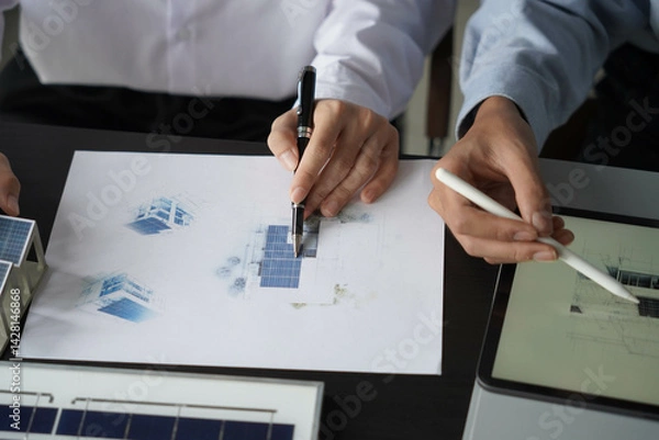 Obraz Group of engineer working together design solar energy system