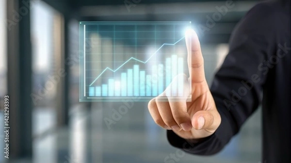 Fototapeta A hand interacts with a digital graph, symbolizing growth and data analysis in a modern business environment.