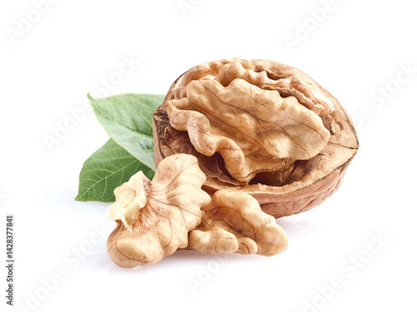 Fototapeta Walnuts with leaves on white background