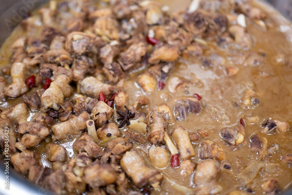 Obraz Simmered Chicken Stew with Spices and Chili in Rich Brown Sauce