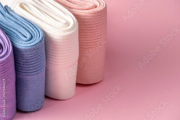 Fototapeta Colorful cotton socks in various shades displayed elegantly for retail shopping