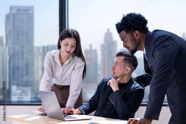 Fototapeta Team of diversity business people are discussing over the new strategic strategy project on investment real estate while working in modern office building for new project and planning