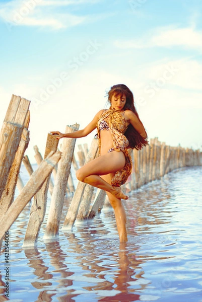 Obraz a girl in a swimsuit on a salt lake