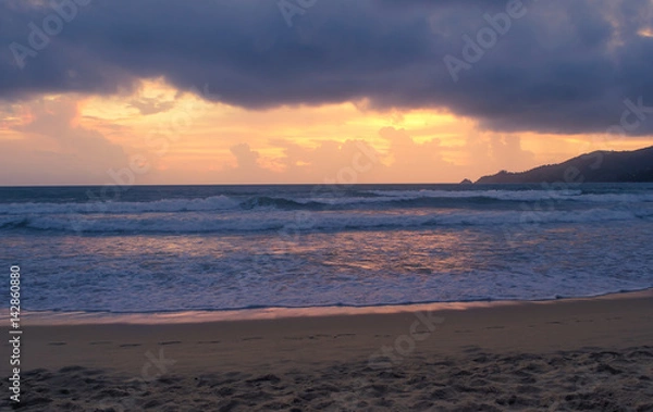 Fototapeta Golden sky at sunset over the andaman sea beach thailand