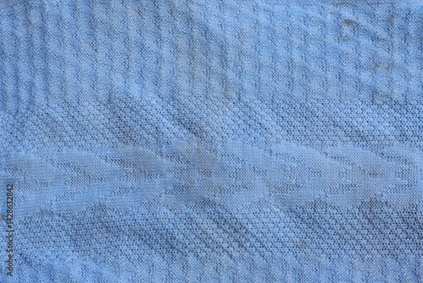 Obraz blue fabric texture of a crumpled piece of clothing on dirty old sweater 