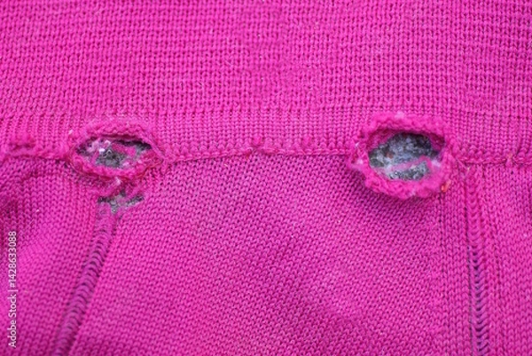 Obraz red woolen fabric texture with a two gray hole in the clothes