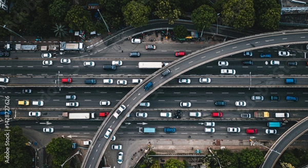 Obraz Aerial view of a multi lane highway with many cars and trucks traveling in both directions in daylight