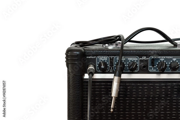 Obraz Black guitar amplifier with jack cable on white background
