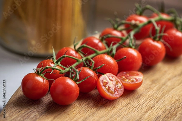 Obraz cherry tomatoes in a cutting board