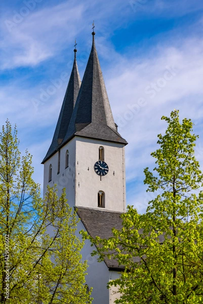 Obraz Protestant Church “Oberste Stadtkirche“ in Iserlohn (Sauerland) with twin clock towers, white facade is a landmark and monument of the old town in Germany. Bell towers on a sunny spring morning.