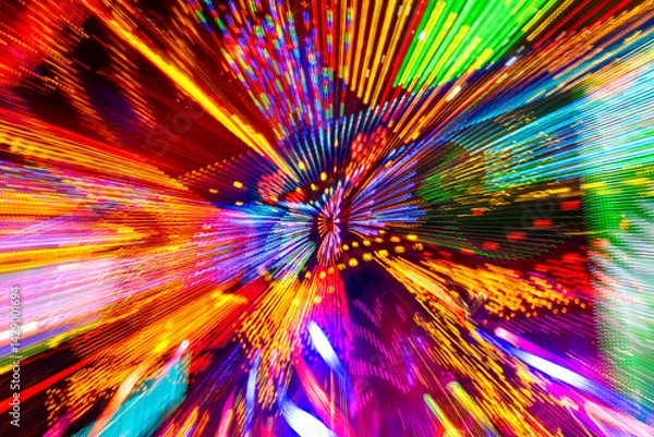 Obraz Colorful lights of a carousel illumination at a funfair or fair in Germany. Movement and zoom effect in all colors against a dark background. Decorative background of hundreds of lamps and LEDs.