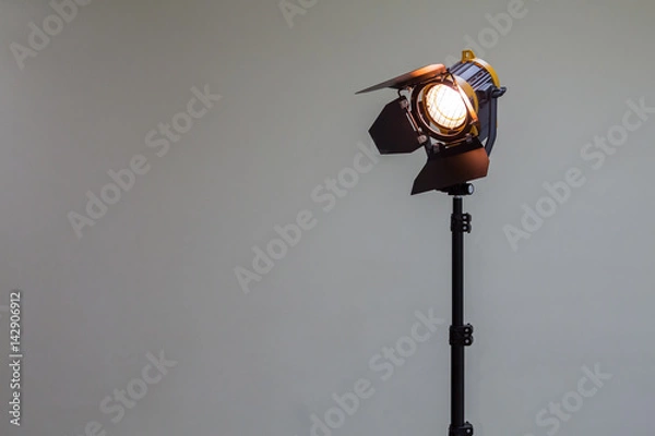 Fototapeta Spotlight with halogen bulb and Fresnel lens. Lighting equipment for Studio photography or videography.