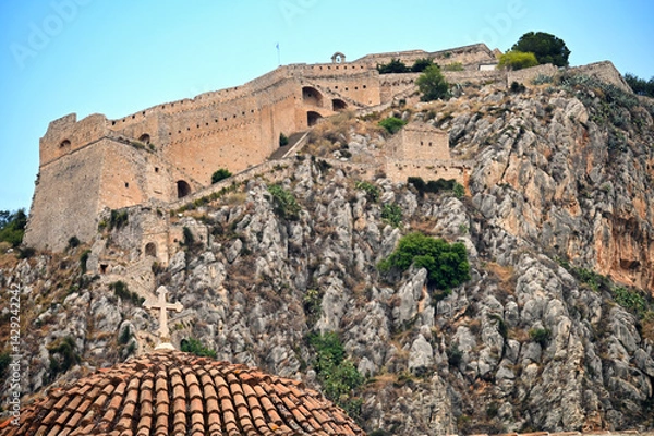 Obraz Church dome with cross and Palamidi castle on the hill above Nafplio city in Greece