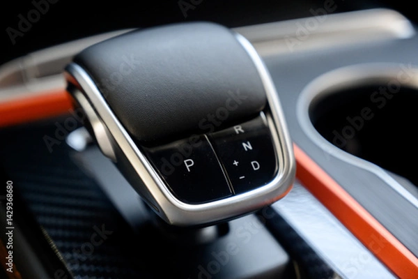 Fototapeta Automatic transmission selector in the interior of a modern car.