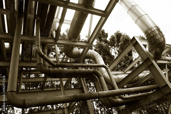 Fototapeta Steel pipelines in a industrial zone.