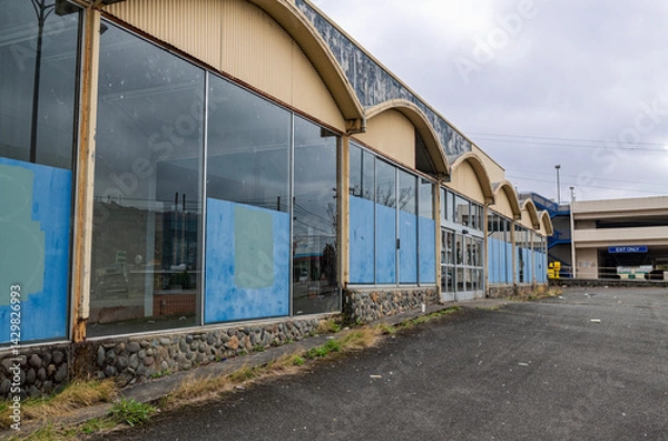 Obraz Arched eaves over the entrance to an abandoned shopping center