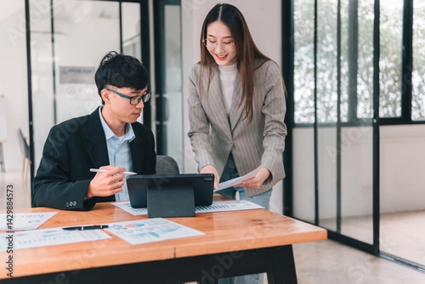 Obraz Collaborative meeting on tech solutions for modern office business strategy and teamwork