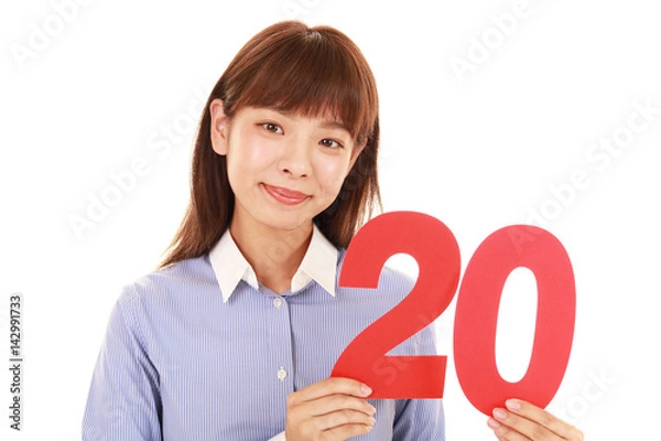 Obraz 数字20を持つ女性