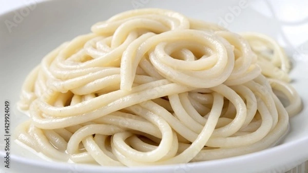 Obraz Delicious plate of soft, creamy spaghetti noodles on a white dish.