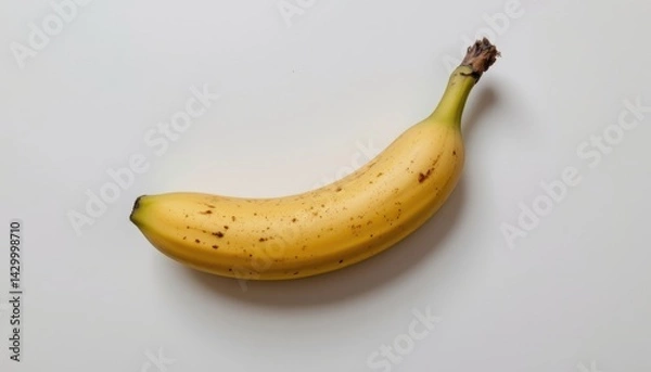 Obraz Banana, realistic style, isolated on a pure white background, minimal composition, soft natural shadows, high resolution, studio lighting, photorealistic