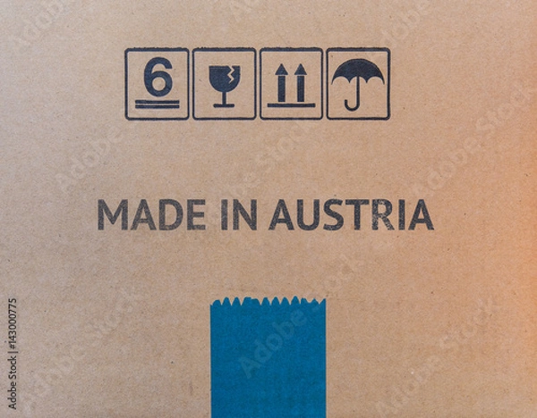 Fototapeta MADE IN AUSTRIA written on brown cardboard box.