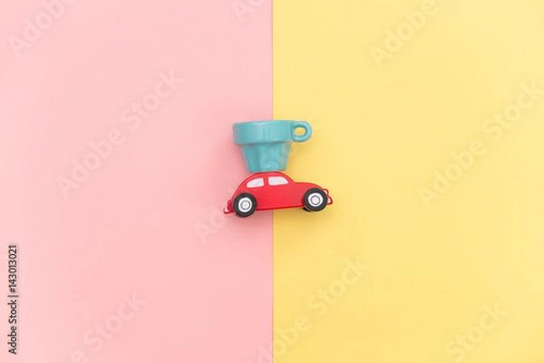 Fototapeta photo of car shaped toy and empty cup on the wonderful background in pop art style