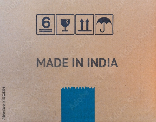 Fototapeta MADE IN INDIA written on brown cardboard box.
