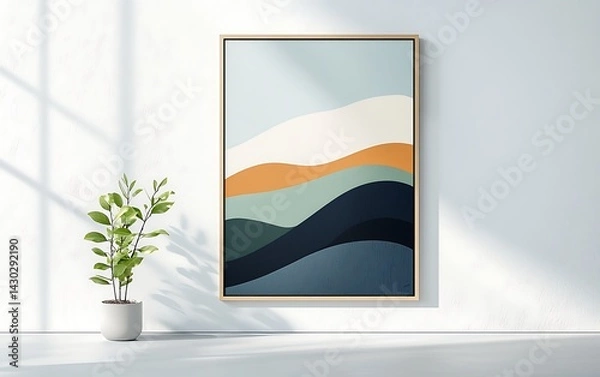 Fototapeta Framed abstract art with layered mountain design, small potted plant, & window shadows