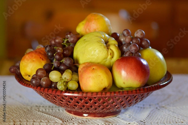 Fototapeta ceramic bowl with various ripe fruits at the table